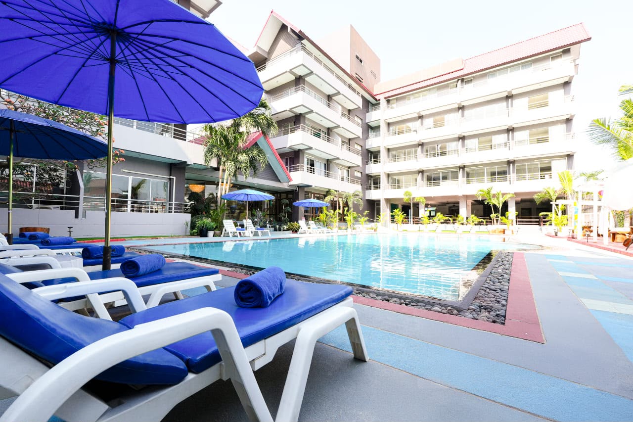 Poolside sunbed area — afternoon view